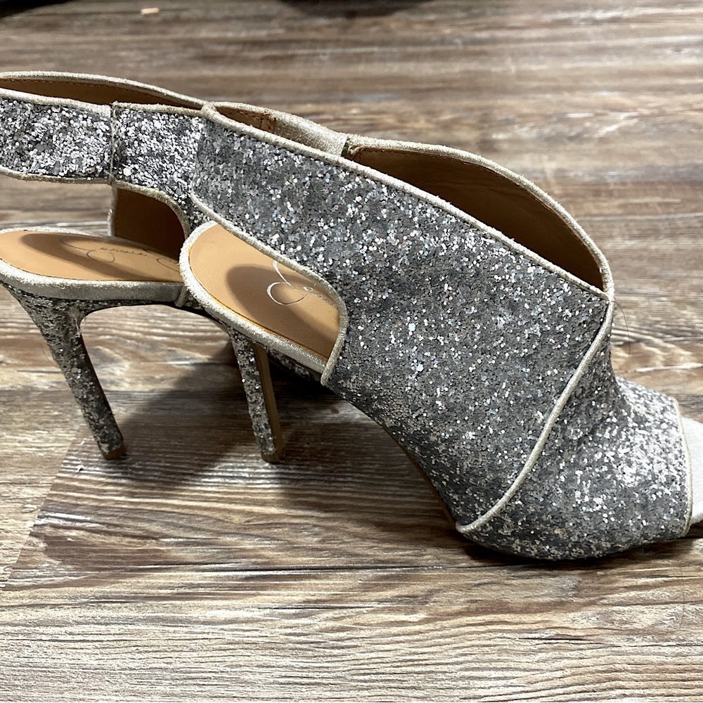 Jessica Simpson’s silver all glitter open toes with ankle straps size 6 heels